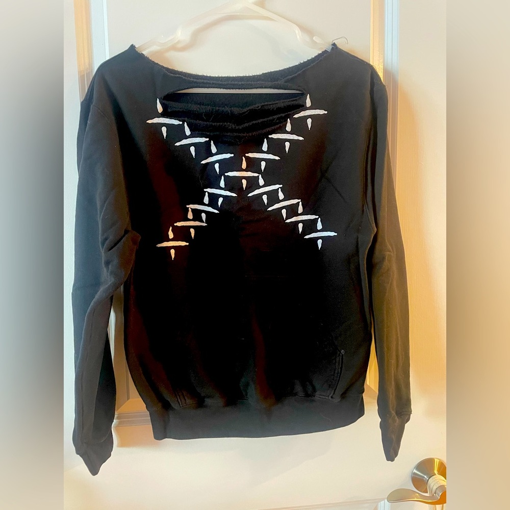 Torn ‘snitches get stitches’ sweatshirt